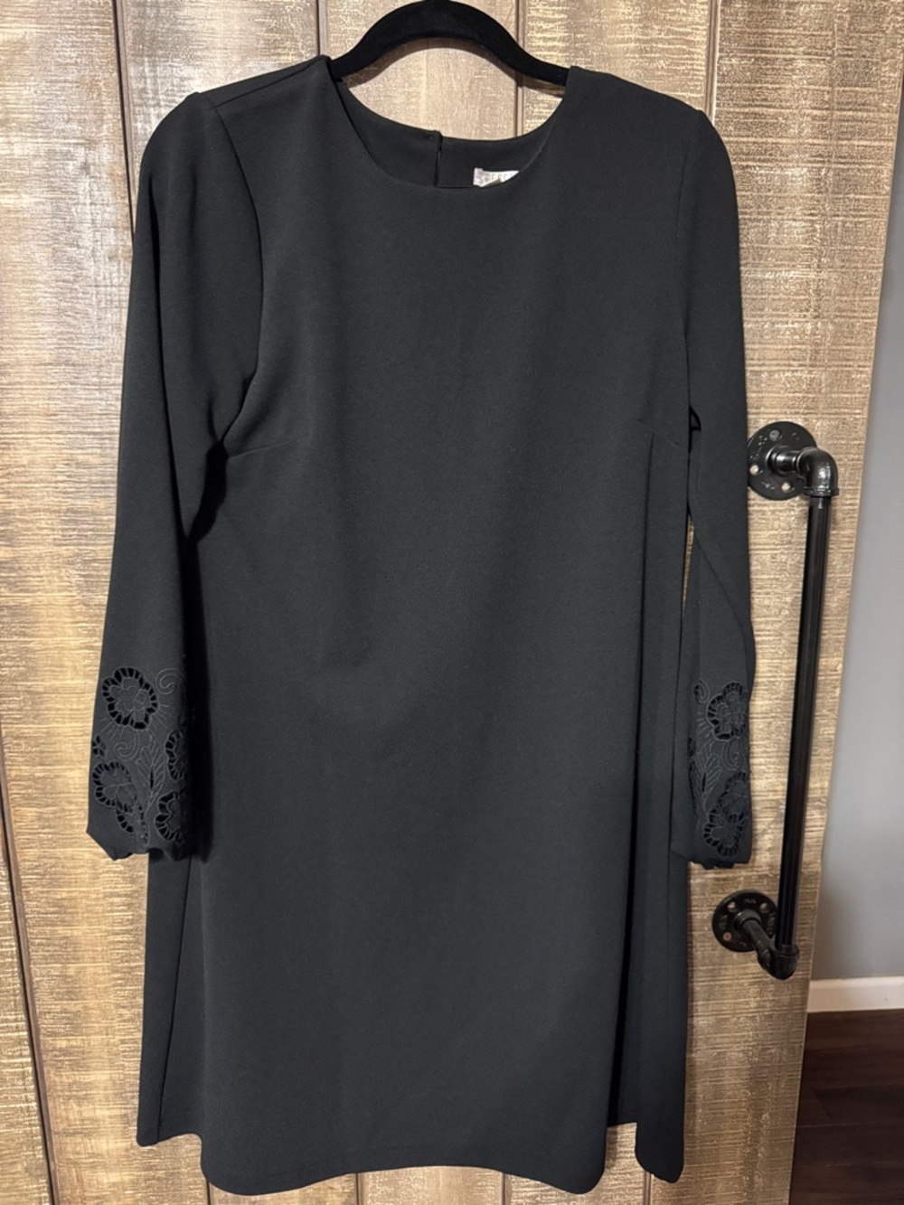 Black dress by Spense with details on sleeves